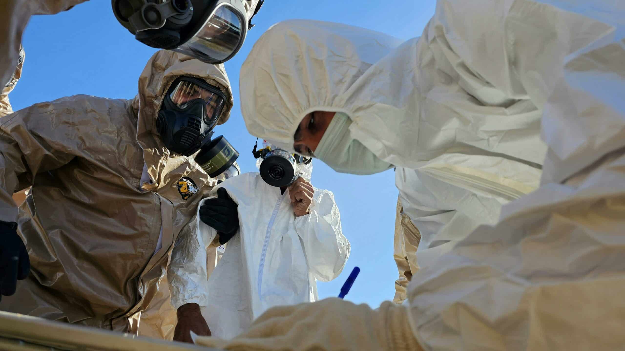 People in hazmat suits